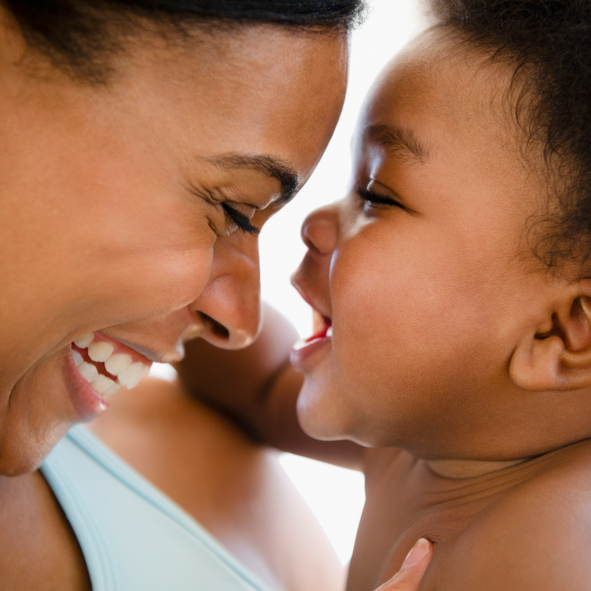 African American mother bonding with baby boy